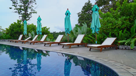 bed pool around swimming pool with mountain hill background