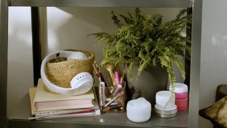 Girl&#039;s stuff on a shelf