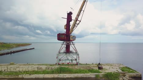 an old abandoned rusty crane in the seaport 04