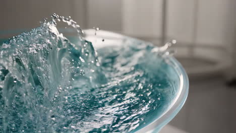 water splashing in a glass bowl