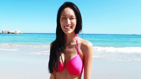 Beautiful-young-woman-smiling-on-beach