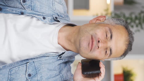 Vertical-video-of-Man-receiving-gospel-on-the-phone.