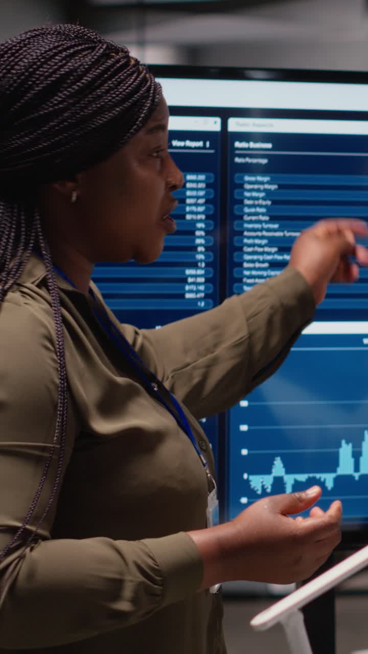 Vertical Video Diverse group of women discusses project development and report indicators