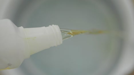 pouring disinfectant liquid