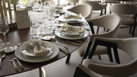 elegant wedding table setting with pristine dishware and glasses