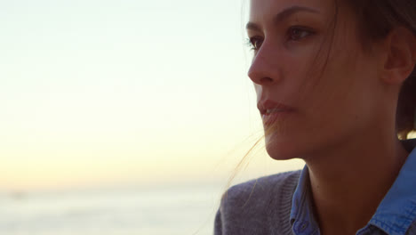 woman blowing sand in the beach 4k