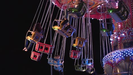 colorful carousel at night in a park in slow motion