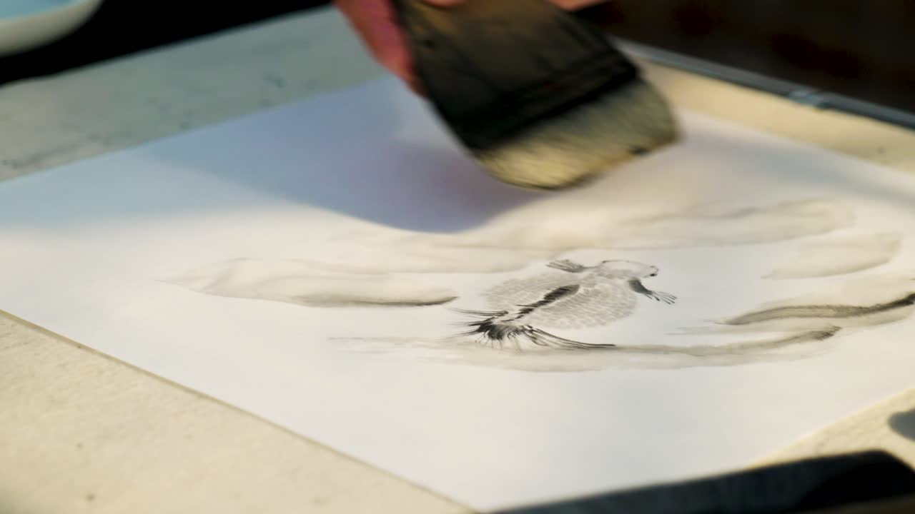 Slow Motion Footage of a Japanese Man Painting a Nihonga, a Traditional Japanese Painting, with Brushes and Black Ink
