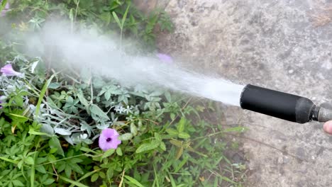 Close-up-shot-of-hand-is-holding-fire-extinguisher-hose-that-spews-HCFC-contents