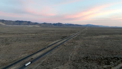 Highway-93-in-Arizona-with-desert-landscape-and-mountains-in-the-distance-with-drone-video-moving-in-and-down