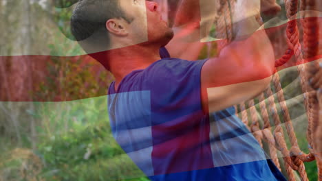 animación de la bandera de inglaterra sobre un hombre musculoso y fuerte escalando