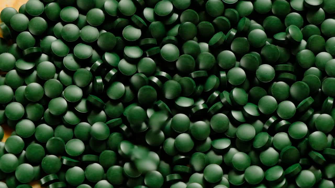 spirulina pills.rotation.healthy food ingredient.omega three alternative source.vegetarian omega three.spirulina algae dry tablets.super food.food supplements.vitamins and macronutrients.