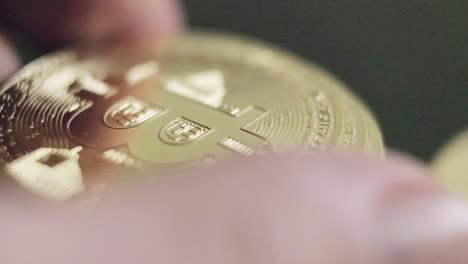 hands holding bitcoin coins cryptocurrency digital currency physical gold investment concept