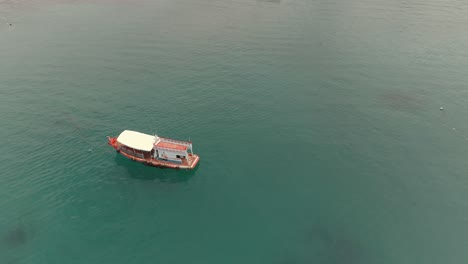 aerial view of two boats in the turquoise ocean