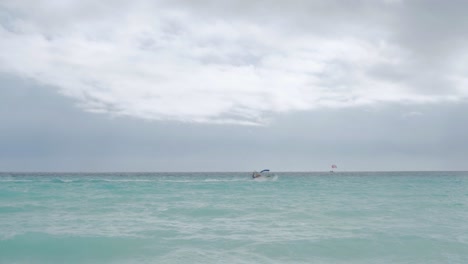 Beautiful-Caribbean-ocean-with-blue-waters-and-a-boat-passing-by