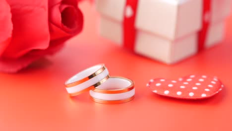 romantic gift with rings and rose