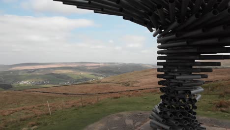 drone reveals singing ringing tree and sweeping landscape