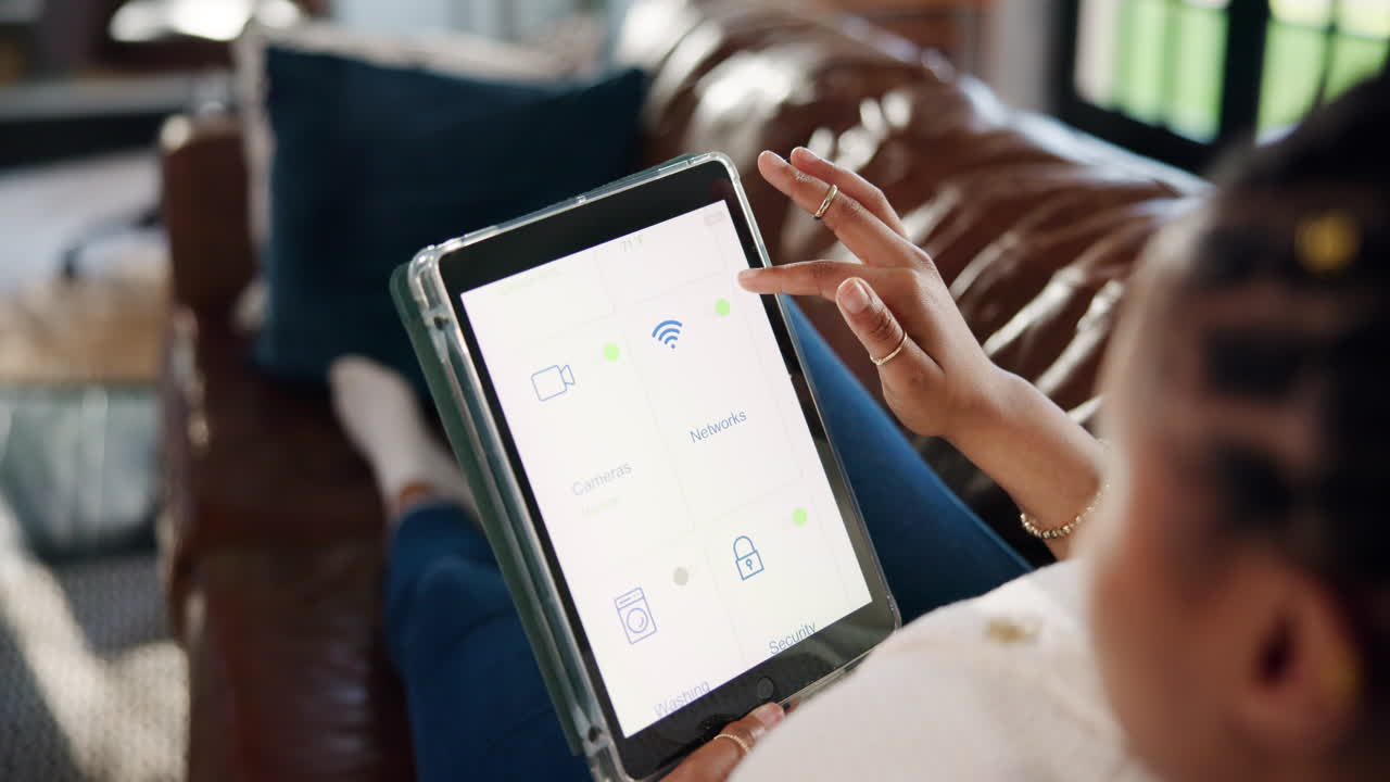 Woman Using Digital Tablet to Control Smart Home System