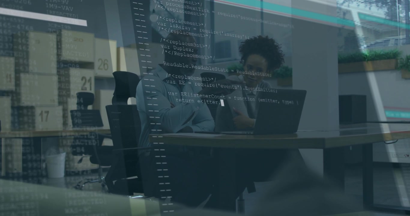 Coworkers pointing at laptop on desk and initiating code overlay for technology debugging session