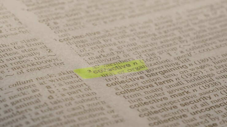 Collective Political Dictionary Highlighter Concept, highlighting a word in a dictionary to show it's definition