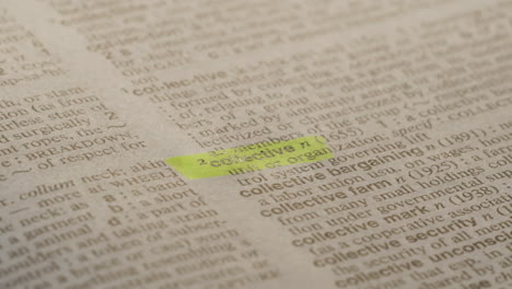 Collective Political Dictionary Highlighter Concept, highlighting a word in a dictionary to show it's definition