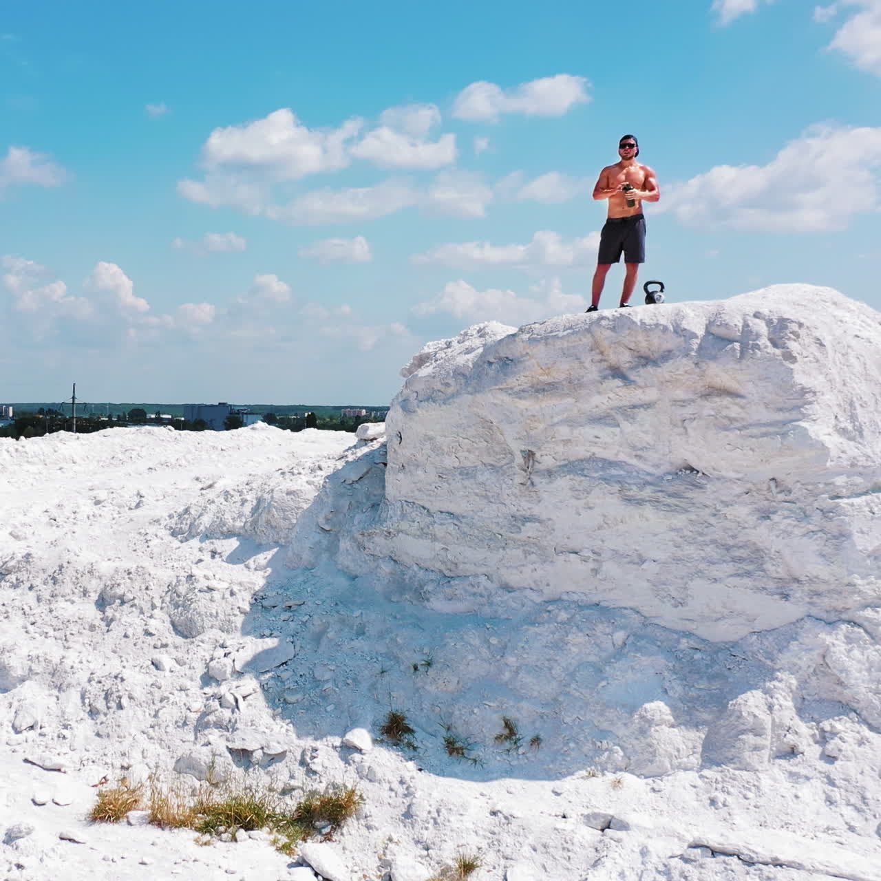 Man with VR Headset on a Rocky Hilltop