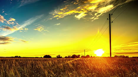 A-Golden-Hour-Shot-Of-The-Sunrise-View-And-A-Wind-Shear-With-A-Field-Landscape