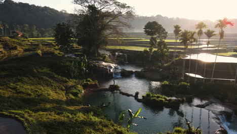 weekacura waterfalls during sunrise in sumba island, indonesia