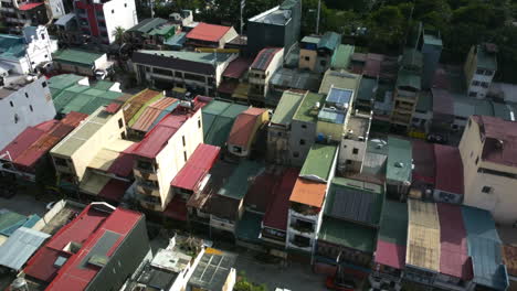 Aerial-view-around-modern-solar-powered-houses-in-sunny-Manila,-Philippines