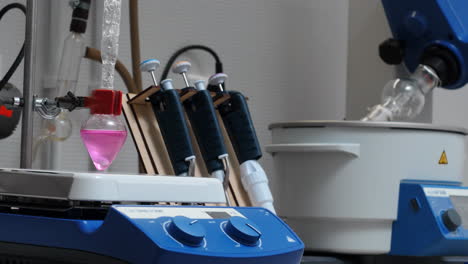 laboratory experiment with pink liquid