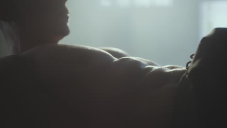 muscular man showing abs