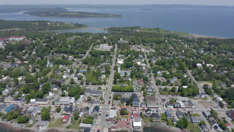 aerial: moving backward high over the town of saint andrews in new brunswick, canada