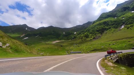 view of the transfagarasan mountain highway from a car, romania
