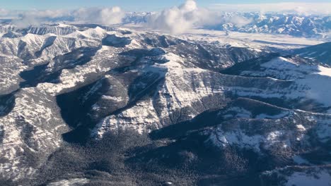 aerial of mountains covered in snow in montana