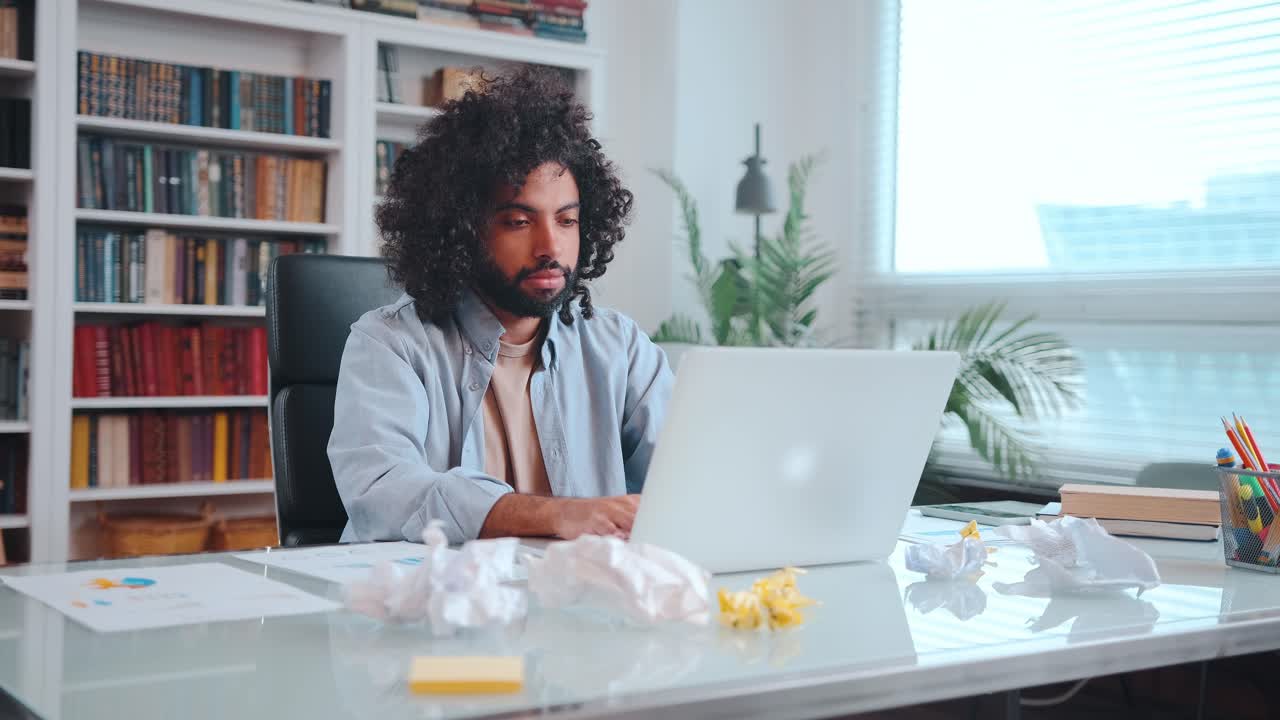 Young african american man engaged in accounting work and is nervous