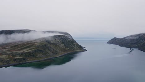 Misty Low Clouds Hugging the Mountains in Norwegian Fjord