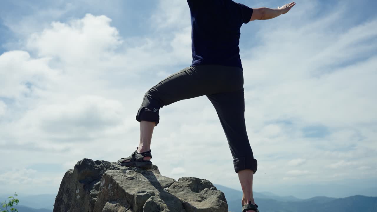 Man on top of a mountain