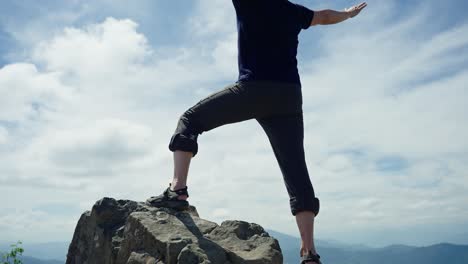 man on top of a mountain