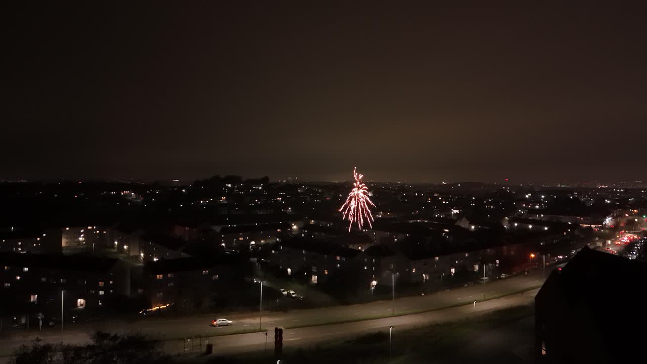 Dark city neighbourhoods, highway traffic, firework night, aerial view