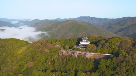 iwakuni castle in japan, aerial establishing shot of yamaguchi mountains