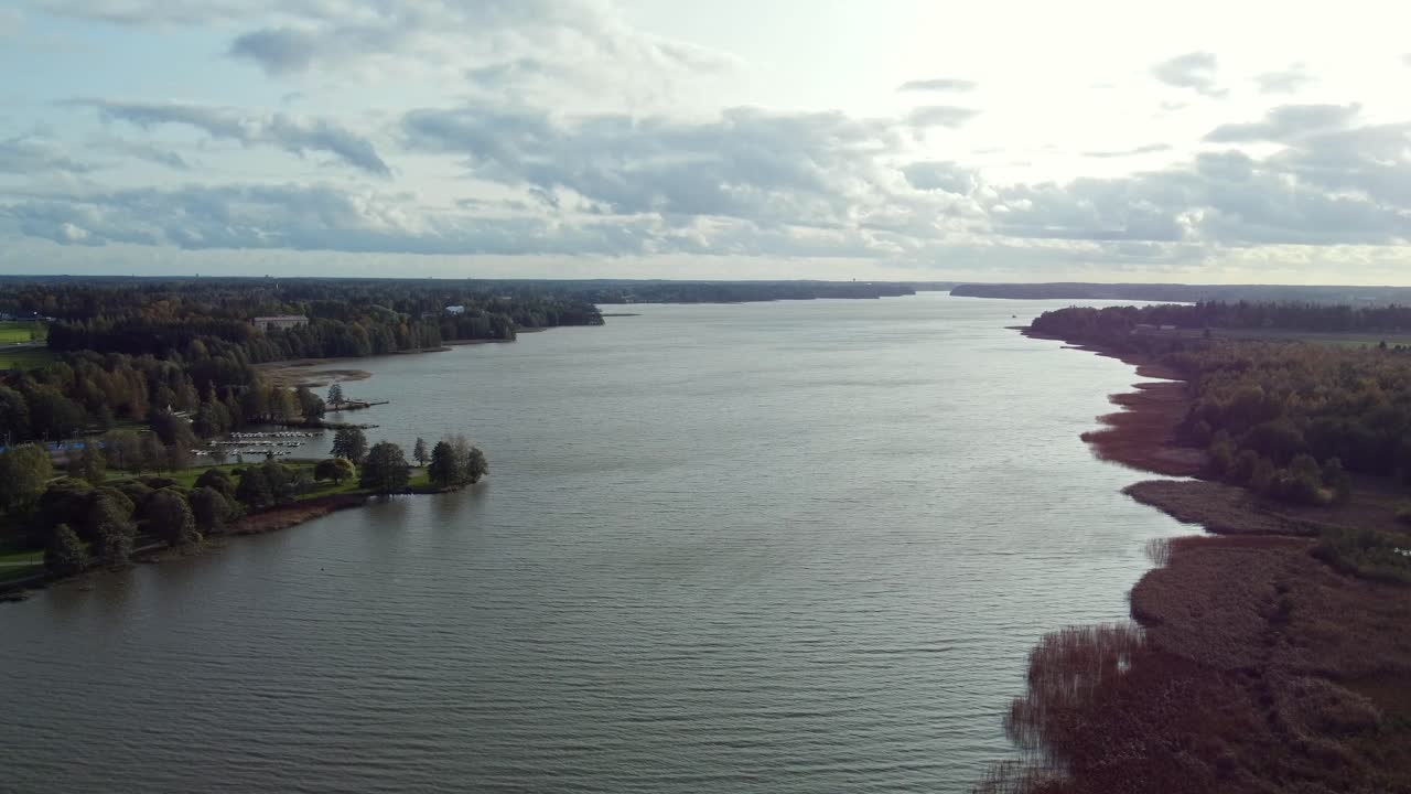 Panoramic aerial view of lake Tuusula on a sunny day, lots of waves with a small pier at the side, J&auml;rvenp&auml;&auml;, southern Finland