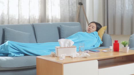 woman sleeping on couch, sick