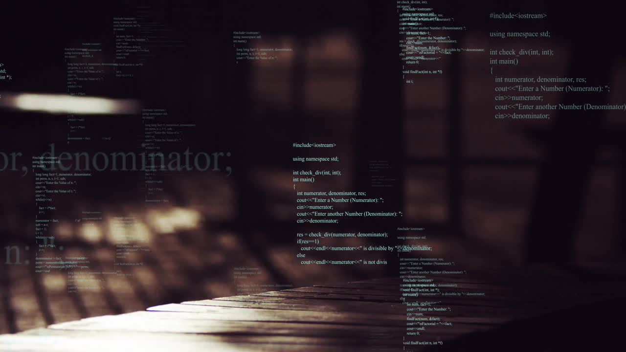 Computer code animation over blurred wooden table and dark background