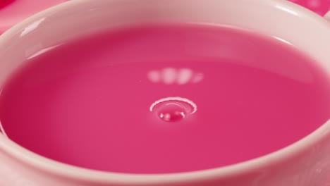 pink drink splash in a cup