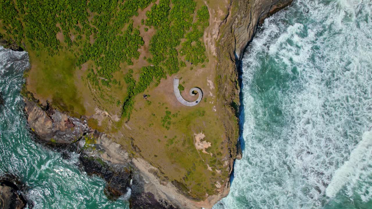 Aerial view rotating above the Muelle del Tiempo, sunny day in Chiloe, Chile