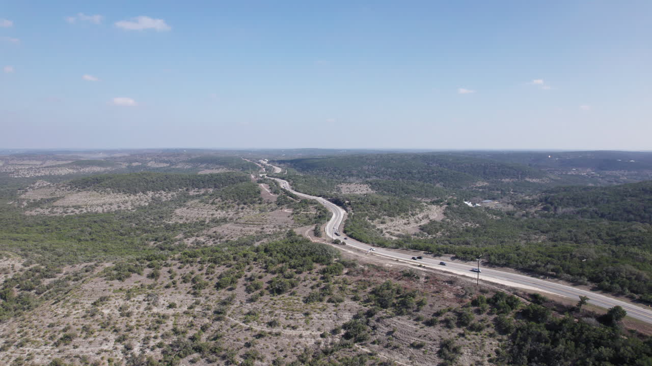 Cars drive along the Devil's Backbone through the Texas Hill Country, between Wimberley and Canyon Lake, Tx