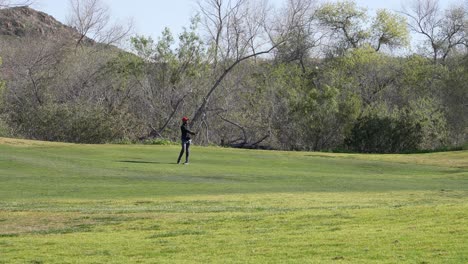 golfer chipping a golf shot