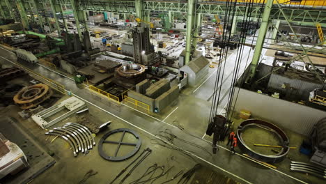 large industrial factory interior with workers