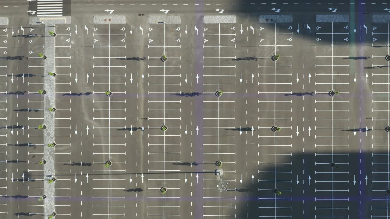 The aerial view on the empty parking lot on holographic background