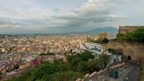 panoramic cityscape with distant mountains and clouds